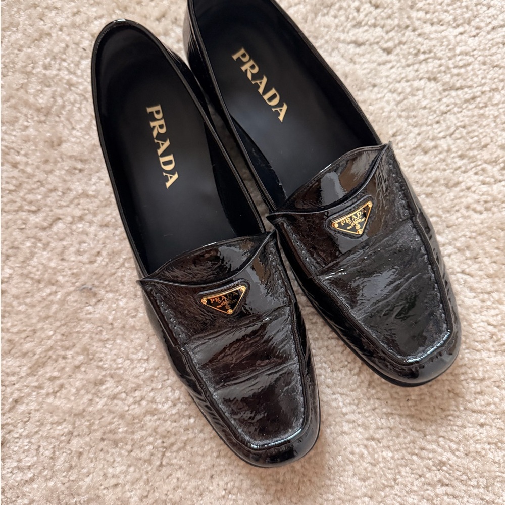 Prada Glossy Black Loafers with Gold Accent
